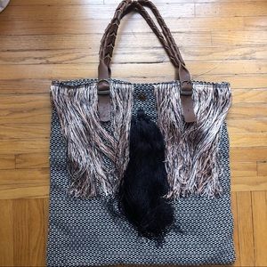 Funky shoulder bag with fringe detail.